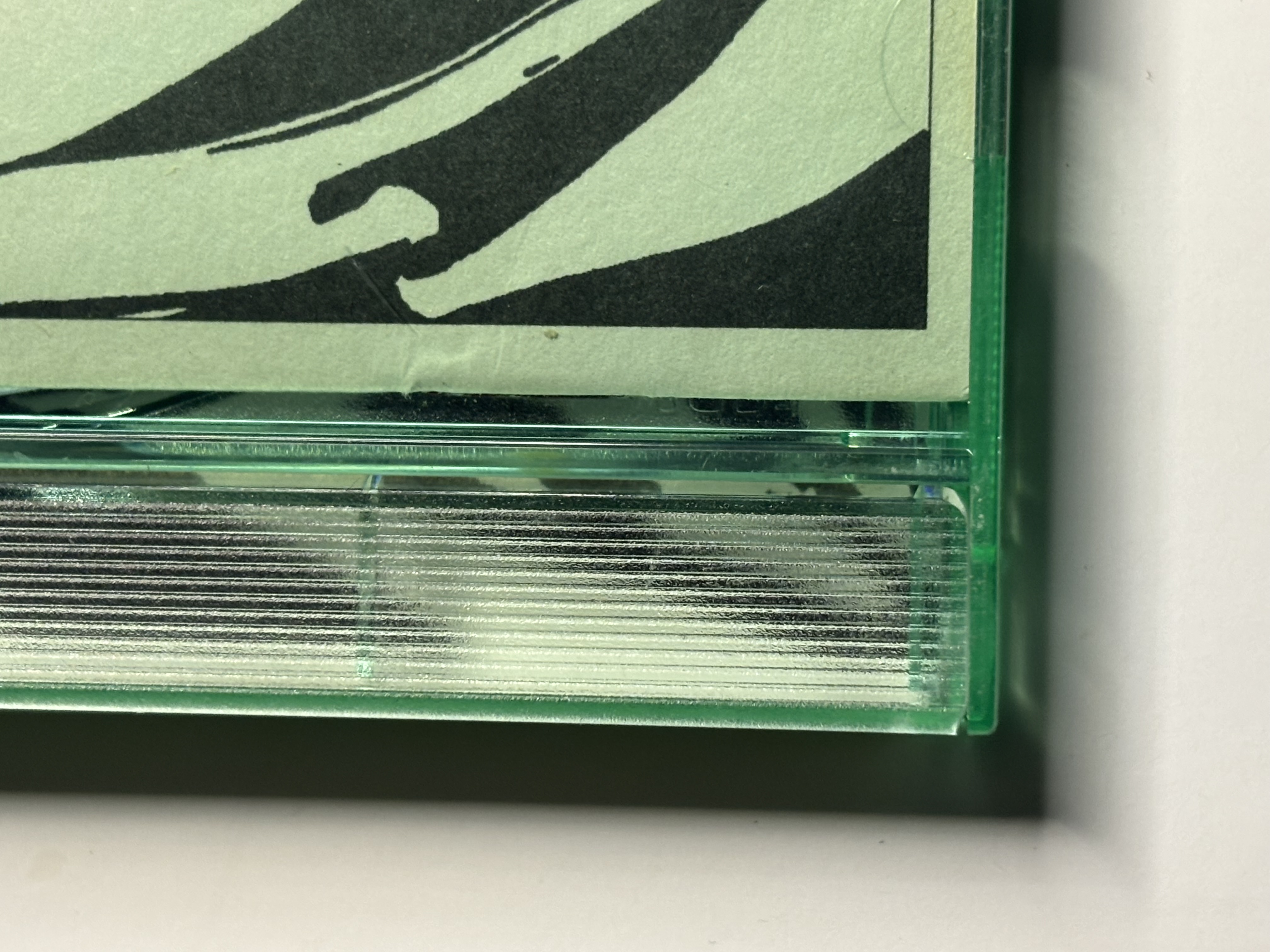 Closeup of ribbed spine on first generation green Rykodisc tray